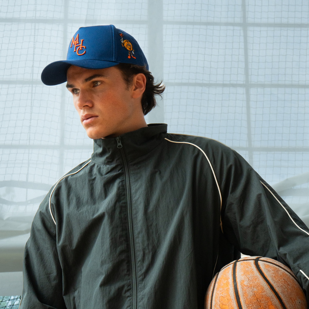 Model wearing our cream and black monday trucket hat